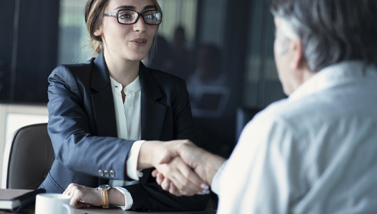 woman and older man business meeting