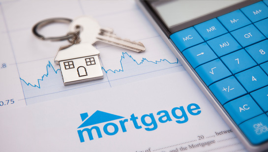 mortgage papers and calculator