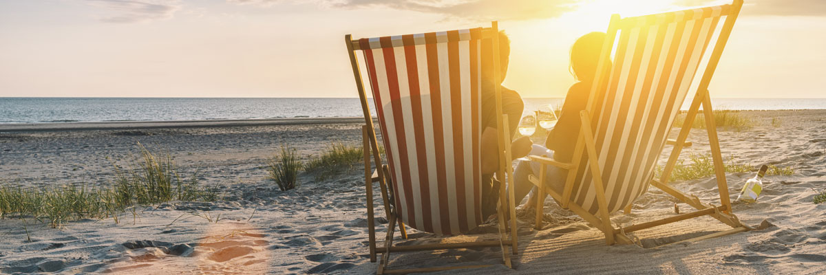 Couple Relaxing in Beach Chairs