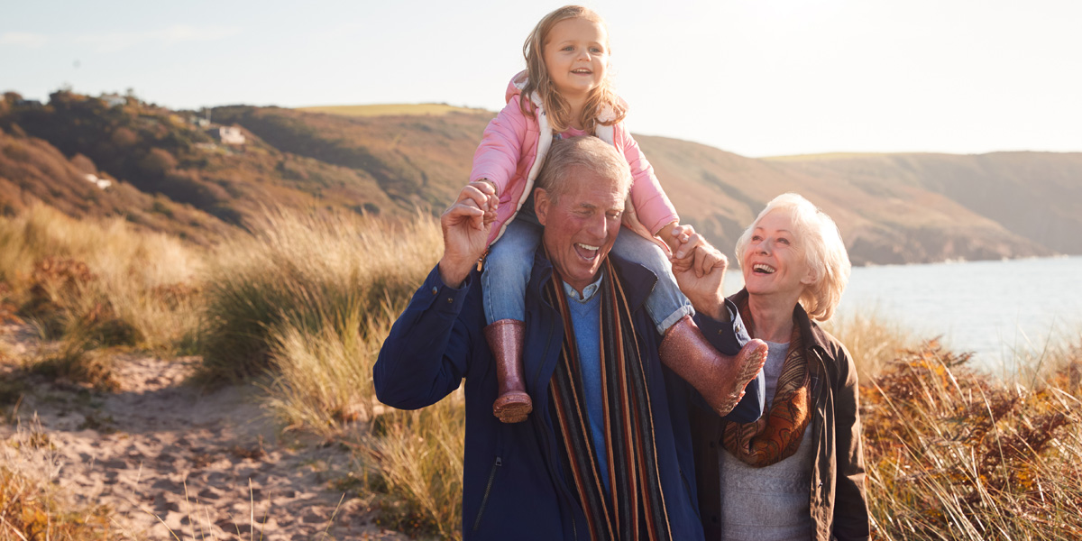 grandparents walking with child