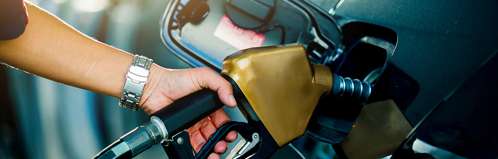 A person pumping gas